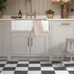 A Country Cream Kitchen with Harvey Maria Checked Flooring in Kiln Luna Black and Selene White Marble Tiles withs Veining