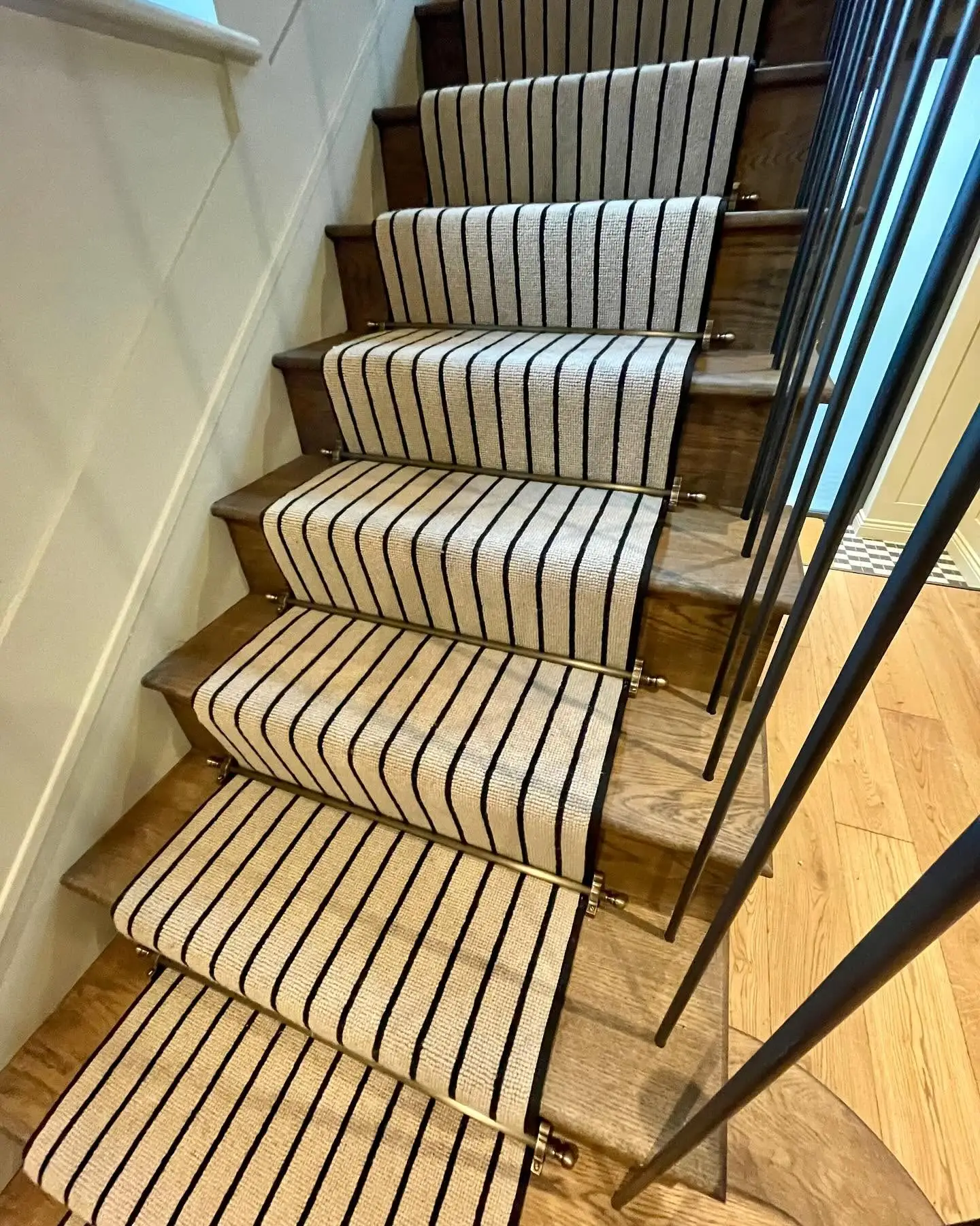 Carpet Runner in Black and Cream Stripes with Matching Black Carpet Tape Runner on a Natural Wood Staircase and Hallway Made and Fitted by Floormaster Yorkshire