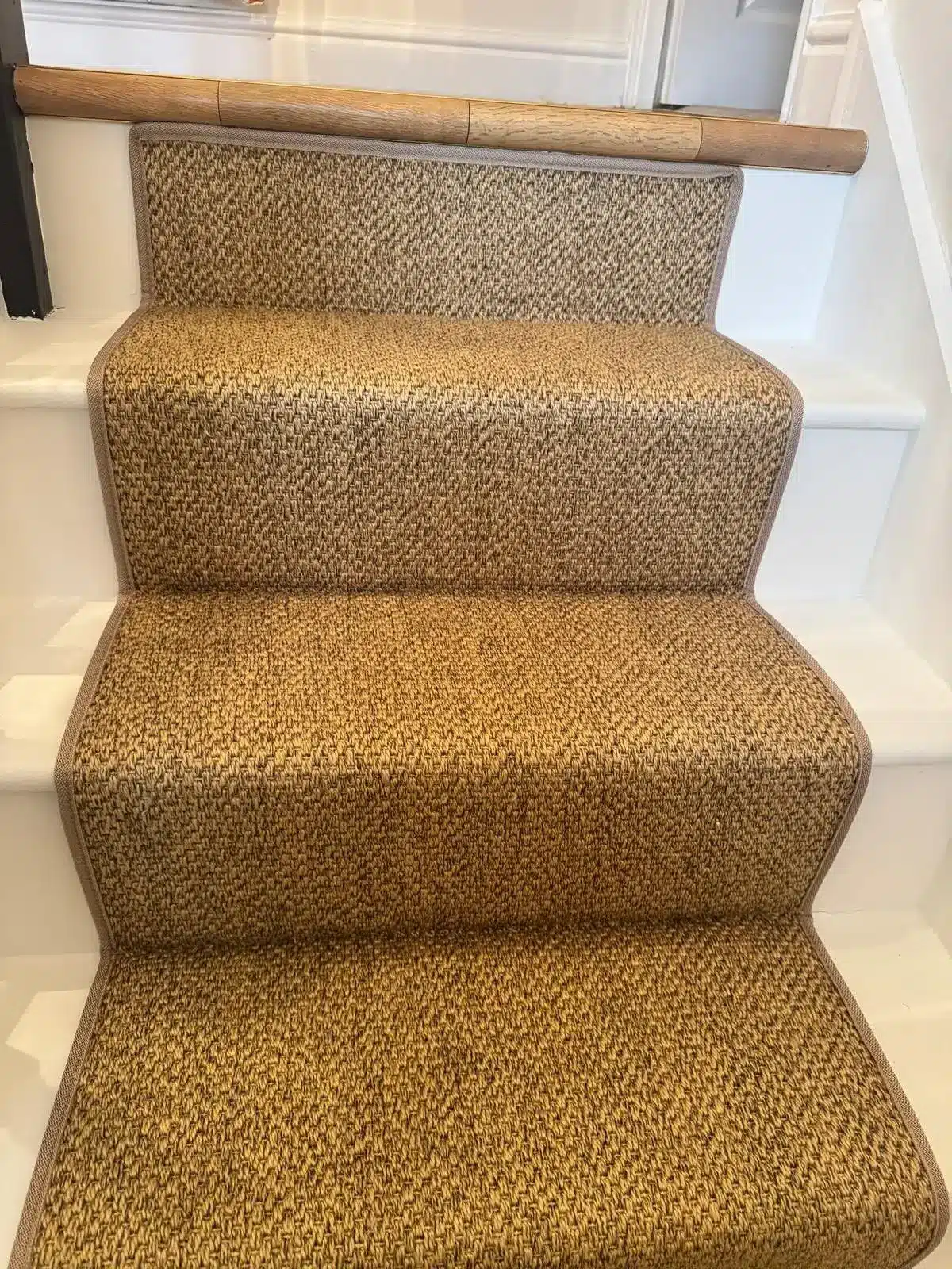 Carpet Runner in Sand Textured Carpet with Matching Sand-Coloured Carpet Tape Runner on a White Wood Staircase Made and Fitted by Floormaster Yorkshire