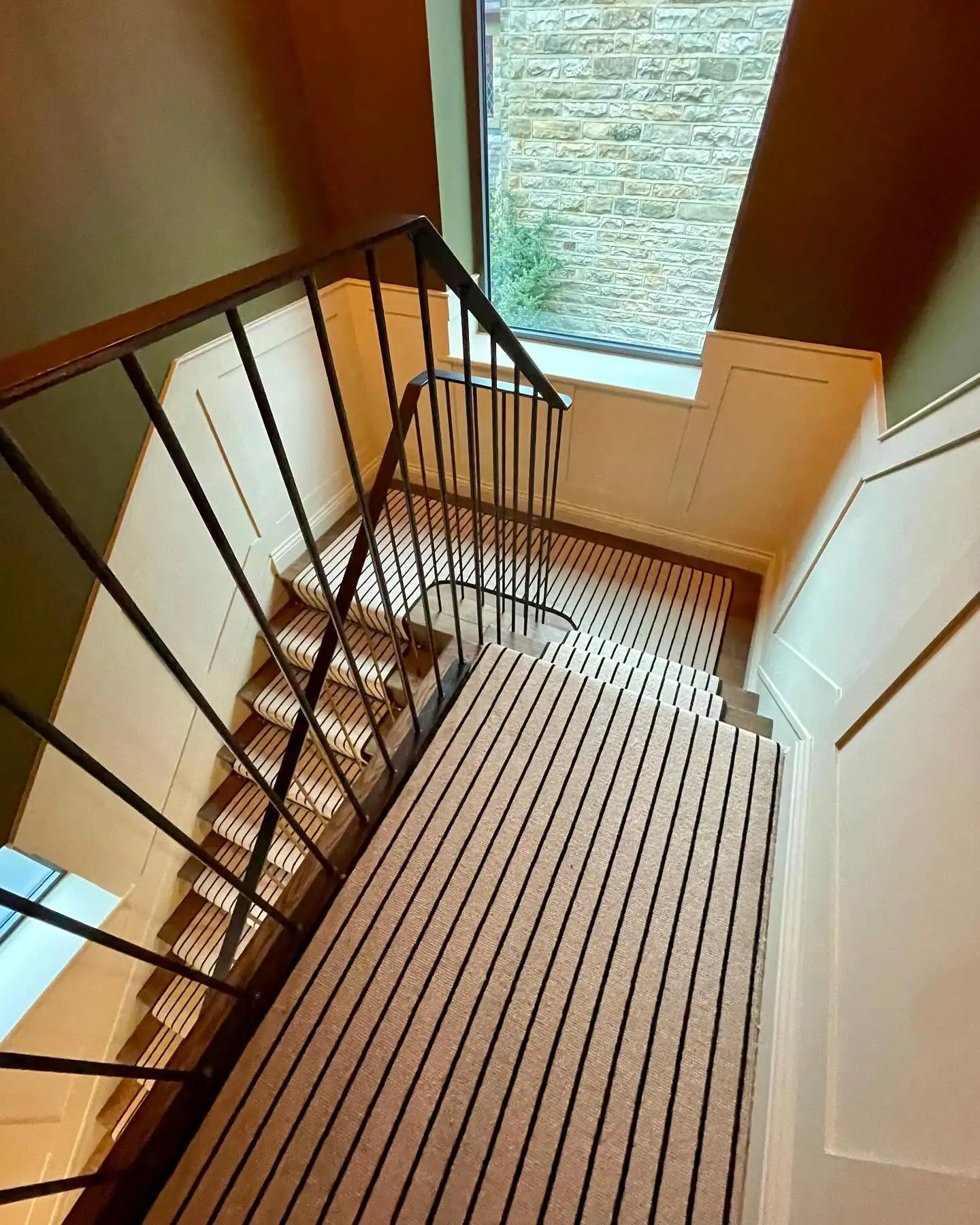 Hallway Carpet Runner in Black and Cream Stripes with Matching Black Carpet Tape Runner on a Natural Wood Staircase Made and Fitted by Floormaster Yorkshire