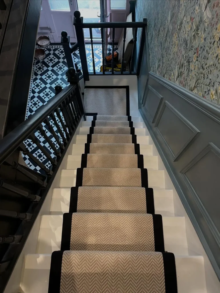 Stair Runner in Beige Tweed with Black Carpet Tape Runner on a White Wood Staircase Made and Fitted by Floormaster Yorkshire