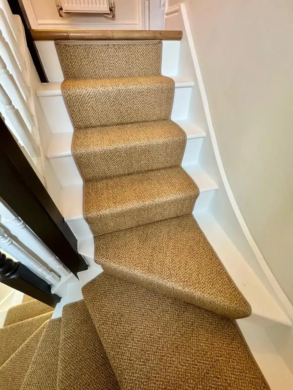 Stair Runner in Sand Textured Carpet with Matching Sand-Coloured Carpet Tape Runner on a White Wood Staircase Made and Fitted by Floormaster Yorkshire